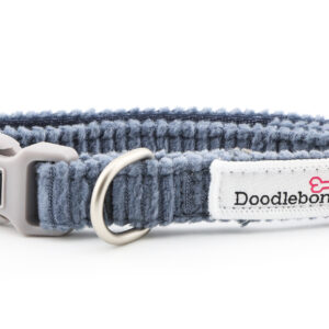 Blue cord dog collar with embroidered dog-themed patches and brushed nickel hardware