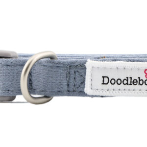 Chalky Blue dog collar with embroidered dog-themed patches and brushed nickel hardware