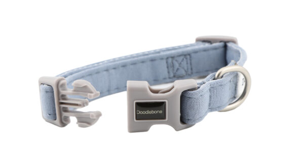 Chalky Blue dog collar with embroidered dog-themed patches and brushed nickel hardware