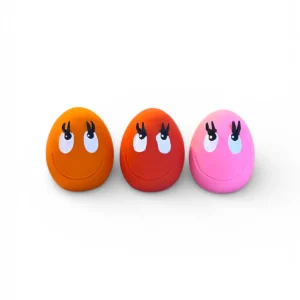 Small OVO Egg dog toys in pink, red and orange made from natural rubber
